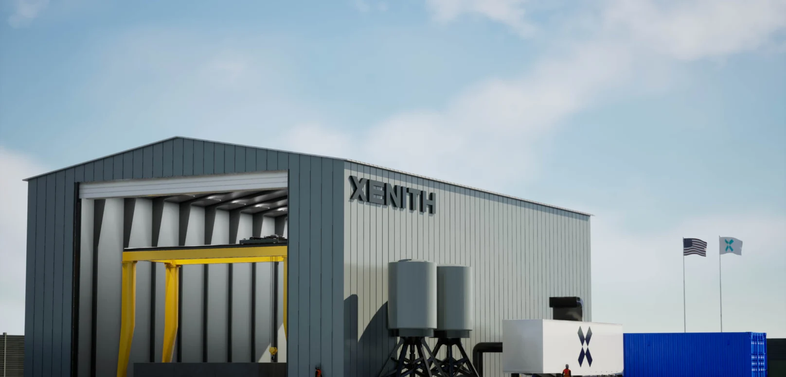 A large industrial building labeled "Xenith" with equipment outside, two flags flying, and a person walking nearby under a partly cloudy sky.