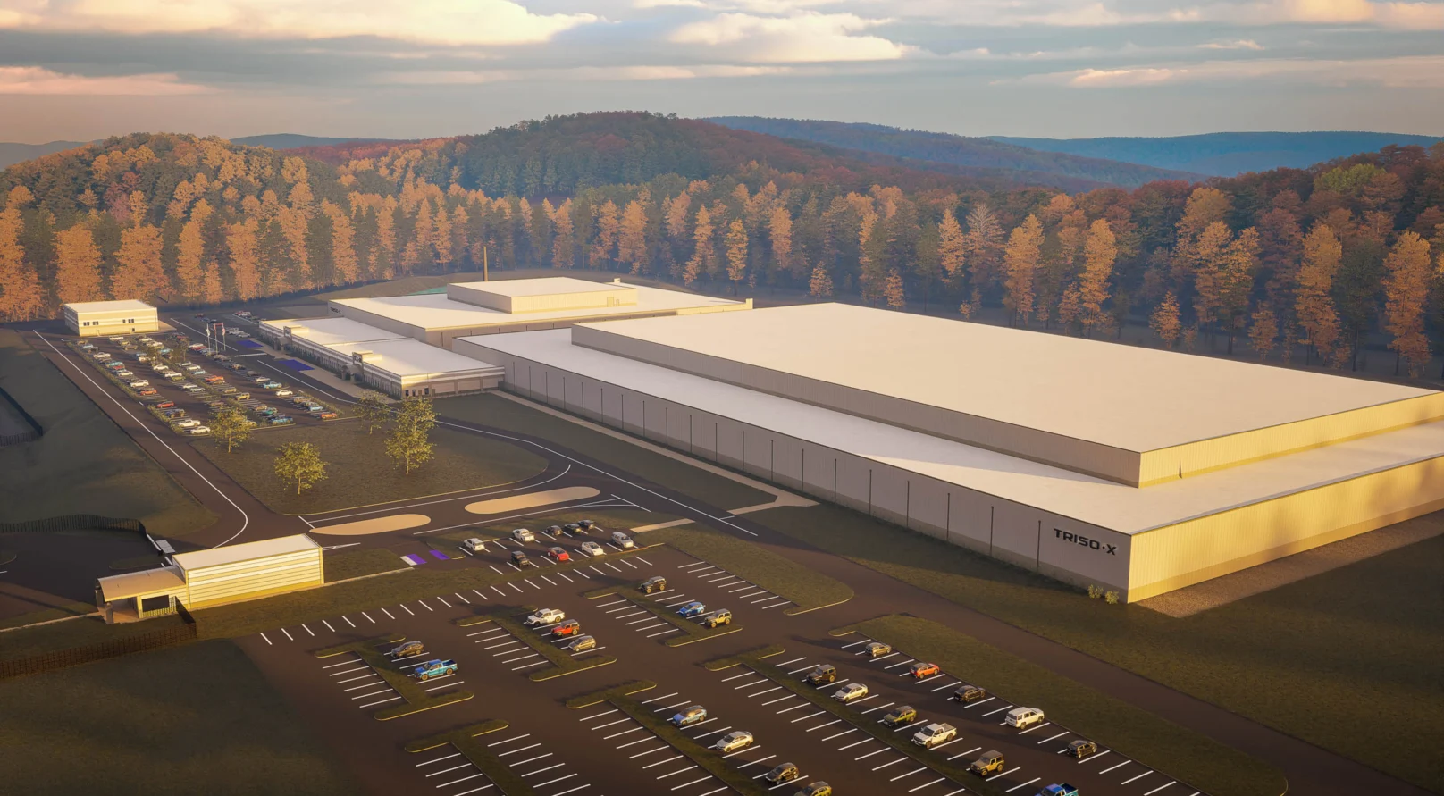 Aerial view of the TRISO-X industrial facility, including parking lots and surrounding forest.